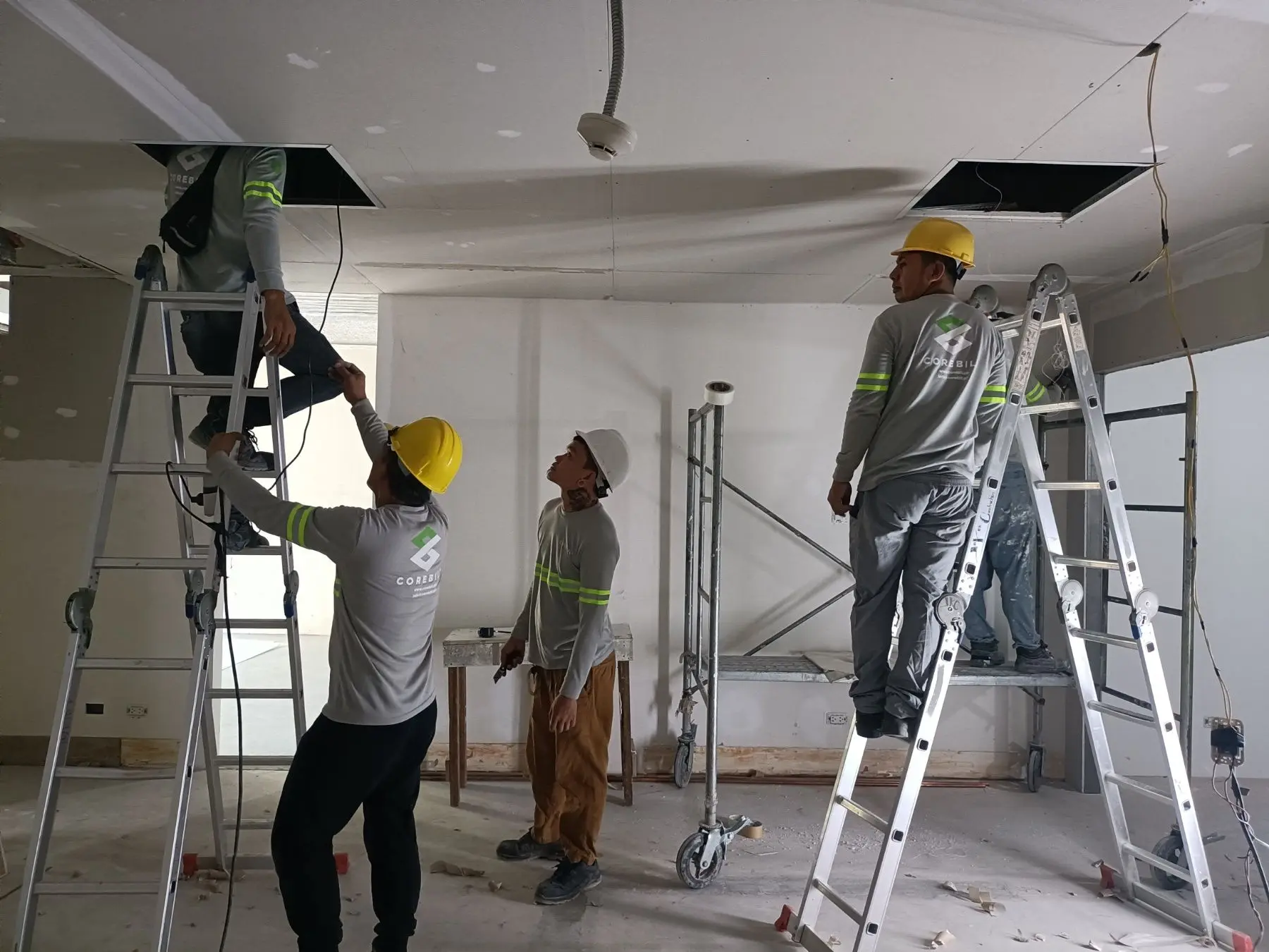 Contractors installing electrical wiring